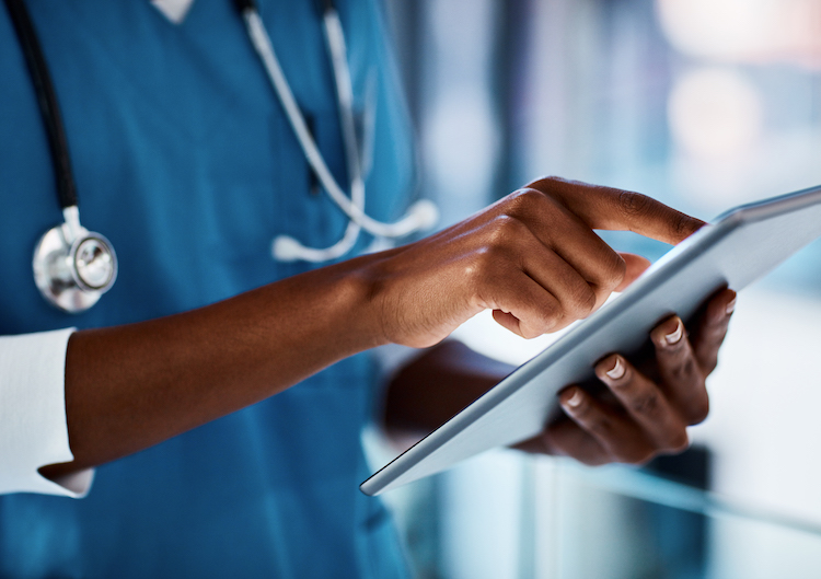 Cropped shot of a doctor using a digital tablet in a hospital