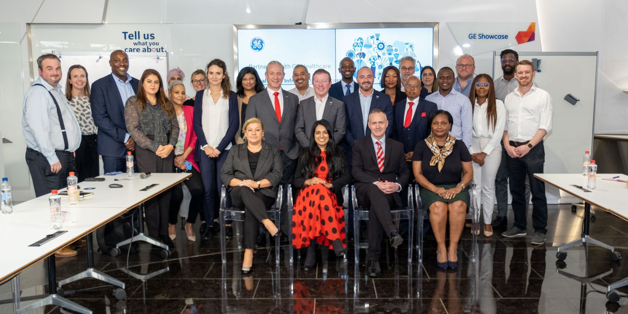 Group of people stood for a photo. Conference about finding international partnerships